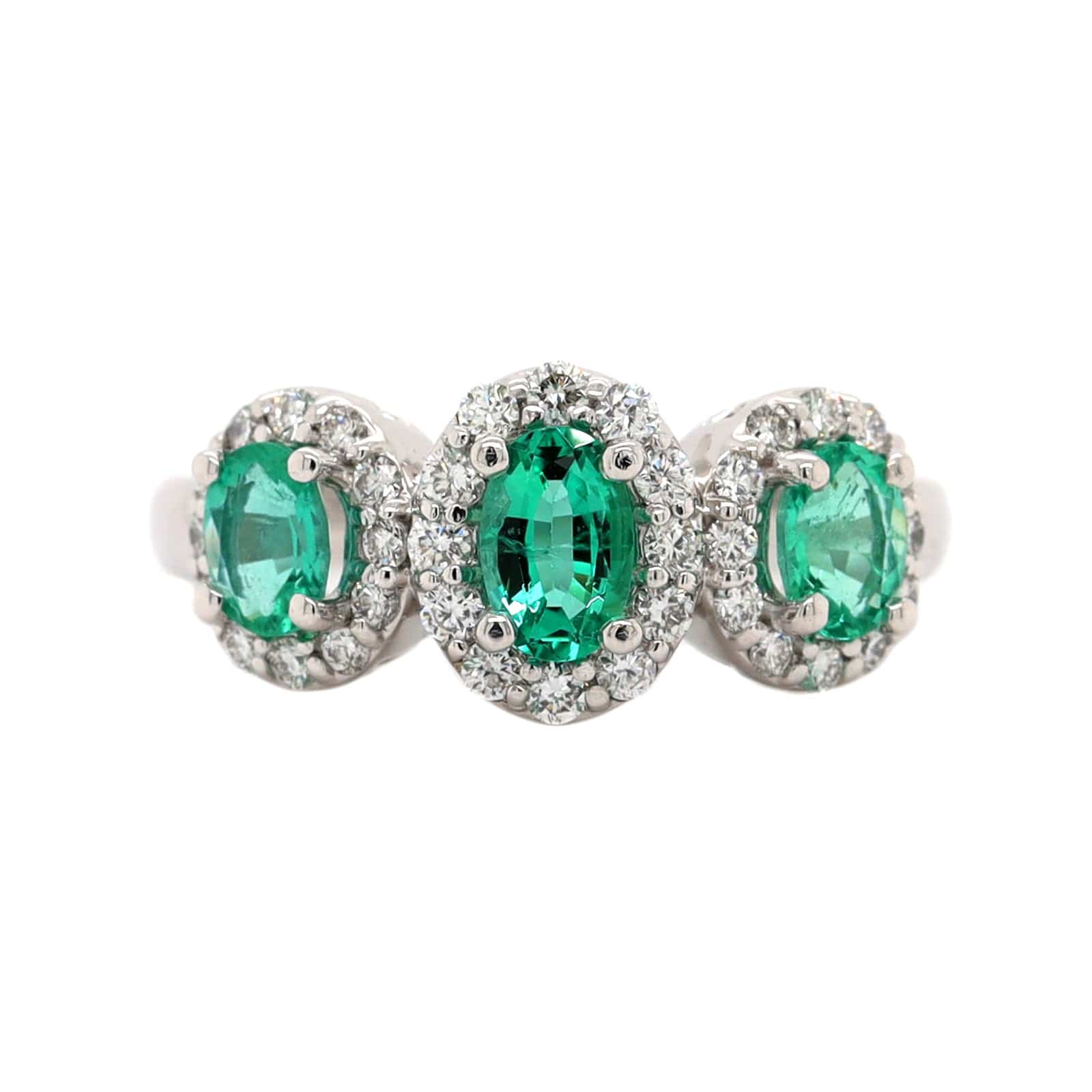 Platinum 3 Stone Oval Emerald and Diamond Halo Ring