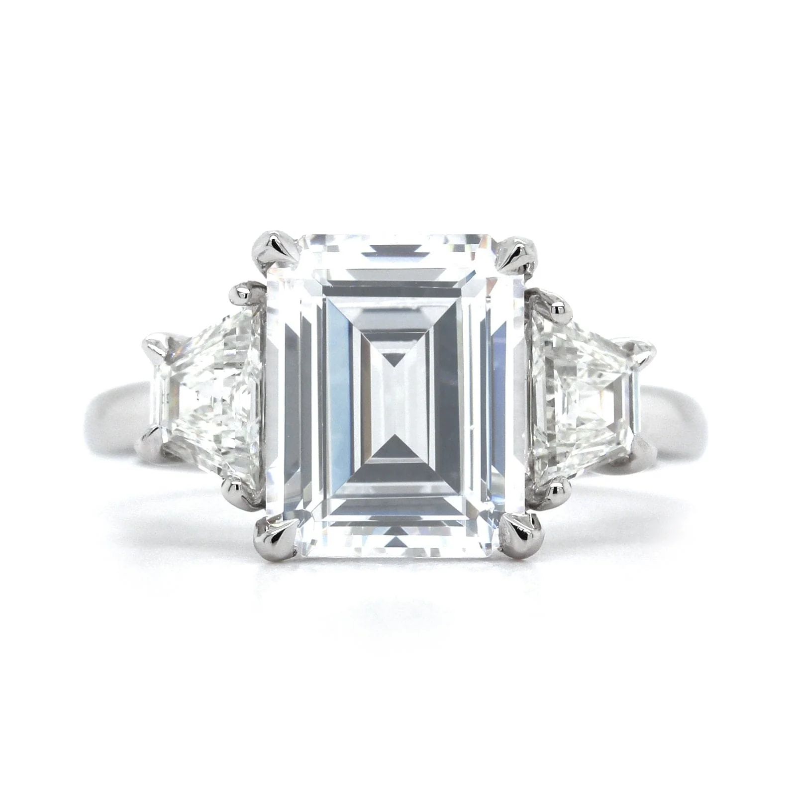 Platinum 3 Stone Emerald Cut Diamond with Trapezoid Sides Engagement Ring Setting