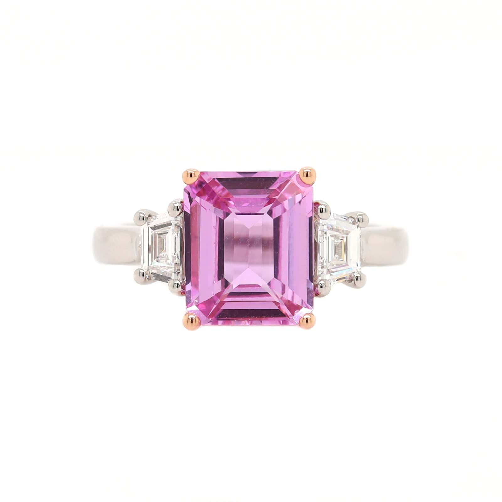 Platinum and 20K Rose Gold Three Stone Emerald Cut Sapphire and Diamond Ring