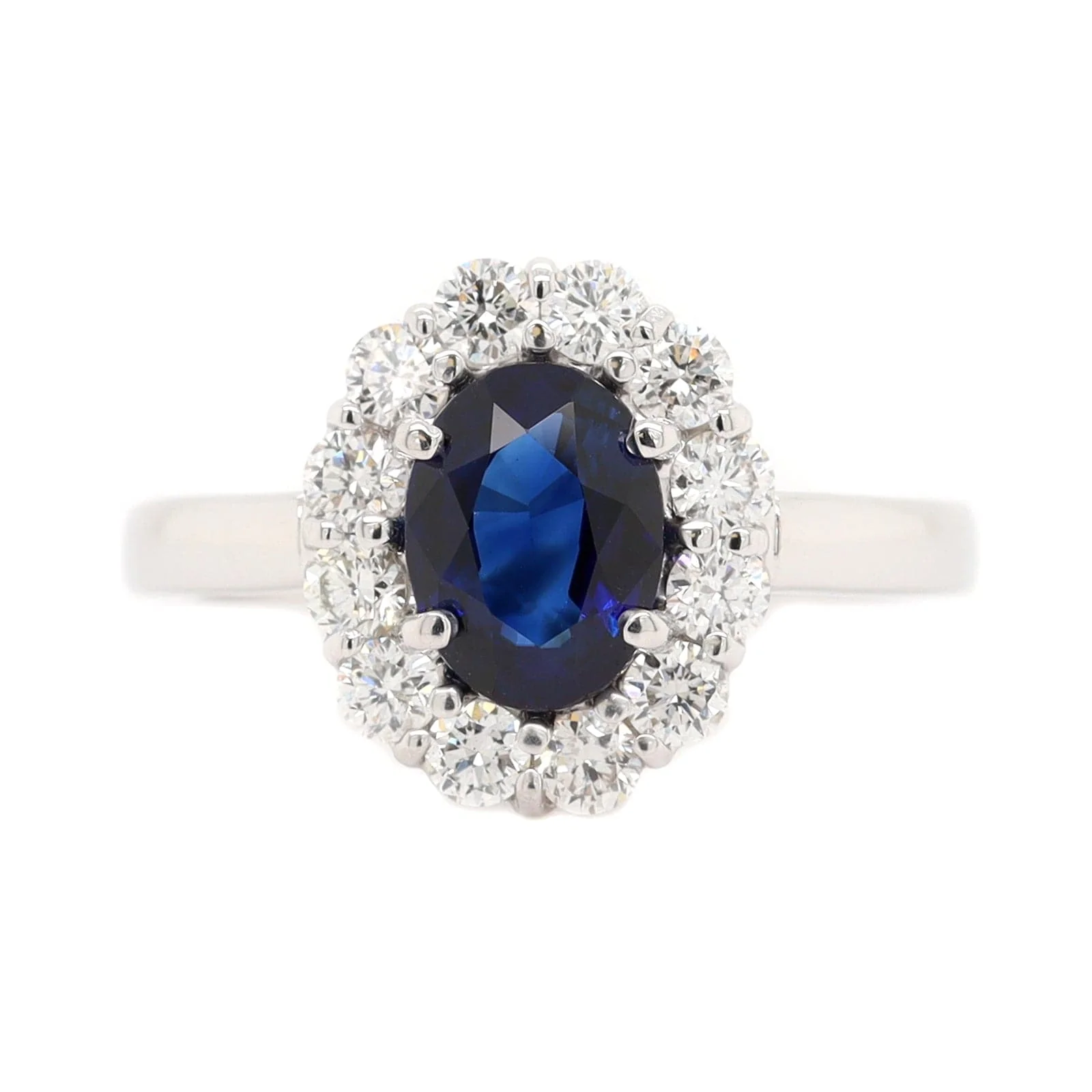Platinum Oval Sapphire and Diamond Halo Ring